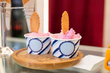 Delicious fruit ice cream in a takeaway cup on display at a cafe
