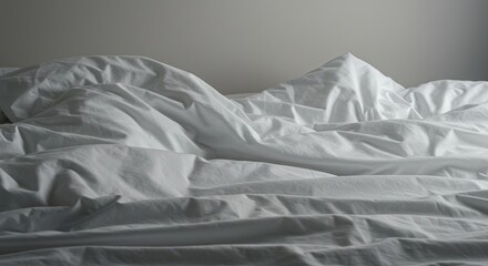 A wide shot of deeply wrinkled white bedding and sheets, resembling mountains and valleys in a stark, comfortable landscape ,linen ,pattern ,landscape