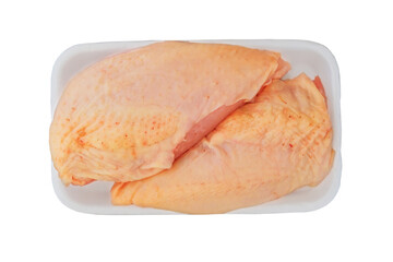 Domestic chicken fillet with skin in plate isolated in white background. Raw meat for cooking. Cooking food at home.