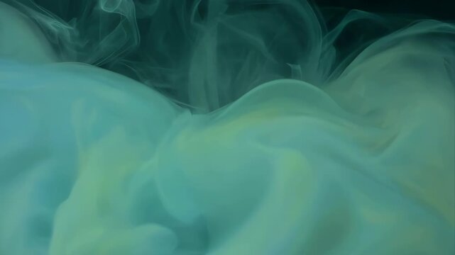 Mysterious green abstract background of smoke and ethereal cloud dark water. Dreamy, fluid motion of ink creating serene pattern