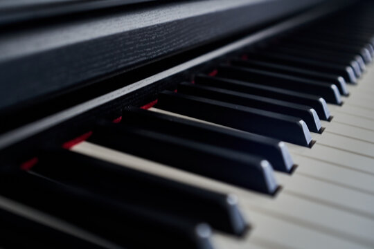 Close up of piano keyboard. Selective focus and shallow depth of field.
