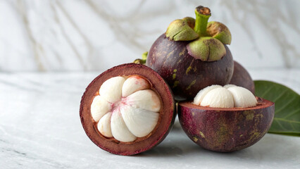 Mangosteen with mangosteen slice isolated in white background