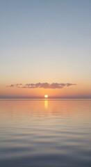 Obraz premium Beautiful sunset over the sea with a calm water surface and soft colors