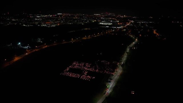 Aerial view of a Polish cemetery on All Saints&rsquo; Night, glowing with thousands of candles that honor the dead and illuminate the darkness with warmth and faith.
