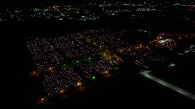 Aerial view of a Polish cemetery on All Saints&rsquo; Night, glowing with thousands of candles that honor the dead and illuminate the darkness with warmth and faith.