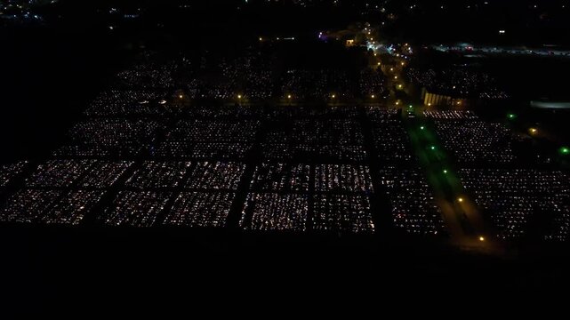 Aerial view of a Polish cemetery on All Saints&rsquo; Night, glowing with thousands of candles that honor the dead and illuminate the darkness with warmth and faith.