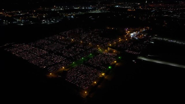 Aerial view of a Polish cemetery on All Saints&rsquo; Night, glowing with thousands of candles that honor the dead and illuminate the darkness with warmth and faith.