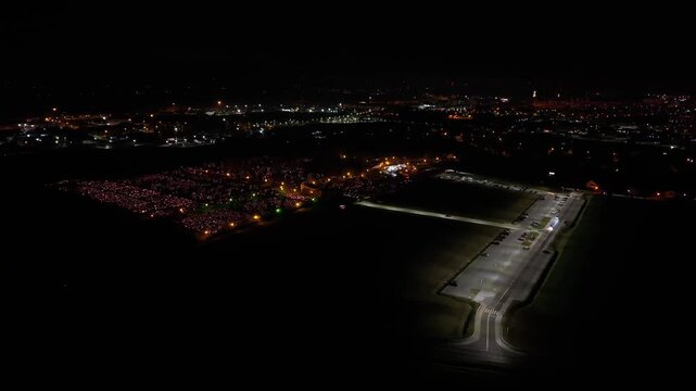 Aerial view of a Polish cemetery on All Saints&rsquo; Night, glowing with thousands of candles that honor the dead and illuminate the darkness with warmth and faith.