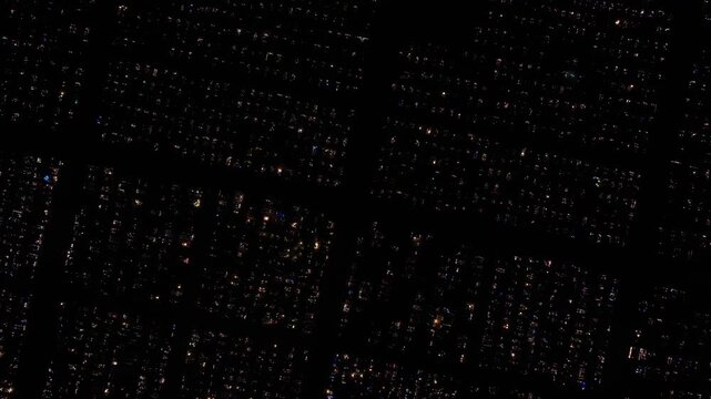 Aerial view of a Polish cemetery on All Saints&rsquo; Night, glowing with thousands of candles that honor the dead and illuminate the darkness with warmth and faith.