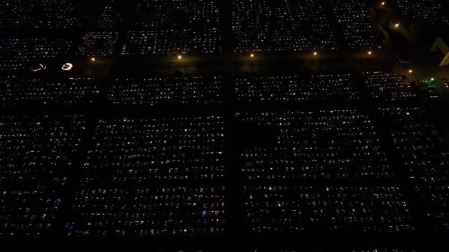 Aerial view of a Polish cemetery on All Saints&rsquo; Night, glowing with thousands of candles that honor the dead and illuminate the darkness with warmth and faith.