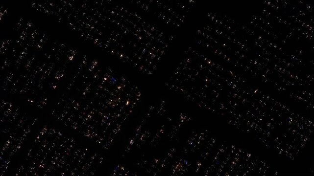 Aerial view of a Polish cemetery on All Saints&rsquo; Night, glowing with thousands of candles that honor the dead and illuminate the darkness with warmth and faith.