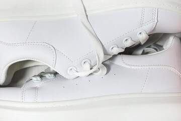 white sneakers background. sport shoes,   Lifestyle sneakers sport shoe. Stylish white sneakers