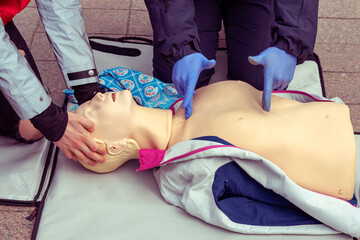 Hands on a mannequin. A person teaches the provision of first aid. CPR First Aid Training Concept.Urgent Care.