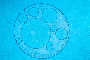Macro blue bubble texture,Close up macro Aloe vera gel cosmetic texture blue background with bubbles. Lemongrass gel skincare product. antibacterial liquid with aloe vera, moisturizing.