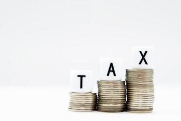 Tax Season: TAX Spelled with Dice placed in the picture of  White Surface and blurred background and foreground digitally generated image stock photo copy space