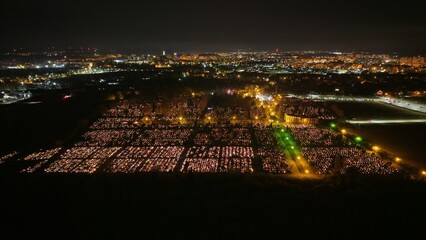 Aerial view of a Polish cemetery on All Saints’ Night, glowing with thousands of candles that honor the dead and illuminate the darkness with warmth and faith.