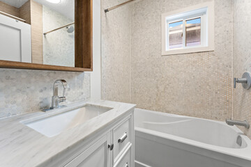 Bathroom with a white sink and bathtub