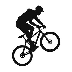 Fototapeta premium Dynamic silhouette of a mountain biker performing a jump over an obstacle on a trail