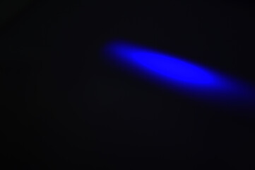 Abstract blue light rays on a dark background. Technology data design. Blue light in the dark