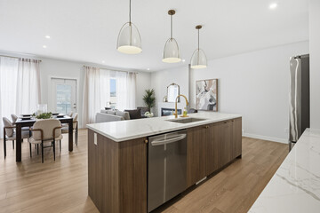 Kitchen with a stainless steel sink and a wooden island