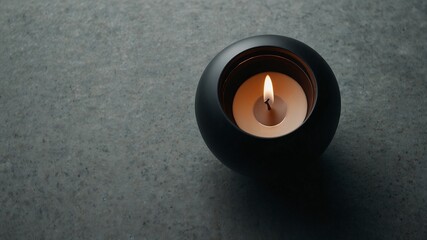 Stone candle holder with tea candle placed in natural minimalistic surroundings showcasing calm atmosphere, organic texture, and elegant simplicity in a serene and balanced composition