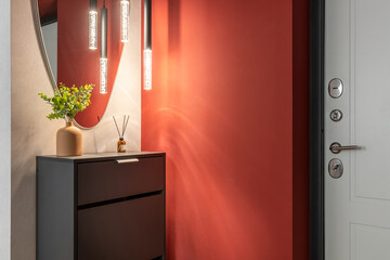 Modern Hallway with Red Wall and Stylish Lighting