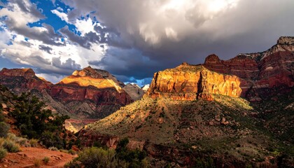 Dramatic sunset illuminates rugged sandstone cliffs in Zion National Park with a stormy sky overhead casting shadows on the vibrant orange and red rock formations below detailed landscape view.