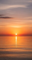 Fototapeta premium Golden Sunset Over Calm Ocean Water Reflecting Sunlight.