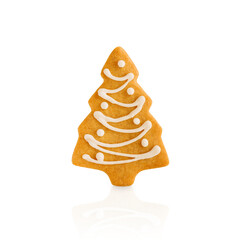 Christmas Gingerbread cookie in fir tree shape isolated on white background with clipping path. Christmas card design element.