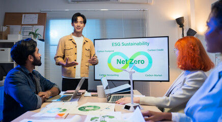 Diverse business team meeting in modern office to discuss sustainability, ESG goals, and eco-friendly strategies focused on green initiatives, environmental responsibility, and corporate ethics.
