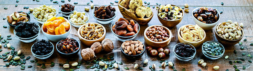Composition with a variety of dried fruits and assorted nuts.