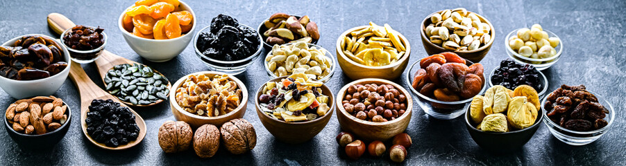 Composition with a variety of dried fruits and assorted nuts.