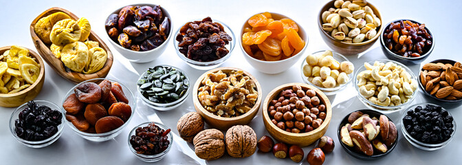 Composition with a variety of dried fruits and assorted nuts.