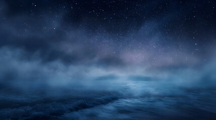 Obraz premium A mystical night sky filled with stars above a serene misty expanse resembling a calm ocean