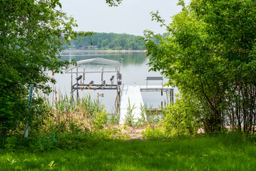 Private boat dock along the Fox River in De Pere, Wisconsin