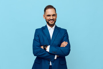 A professional business man stands confidently against an isolated colored backdrop, exuding...