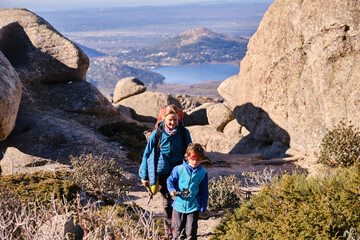 Mother and son walking in the mountains