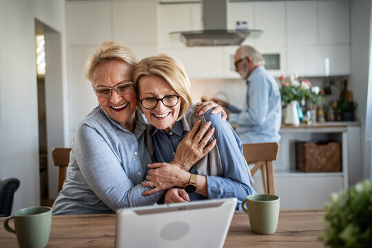 Senior women enjoying video call on digital tablet - Powered by Adobe