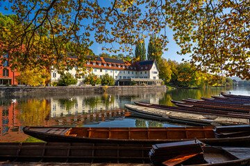 Traditional punt boats (Stocherkahn) on the autumnal Neckar River in T&uuml;bingen