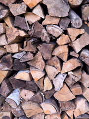 Fototapeta premium Stacked firewood logs background