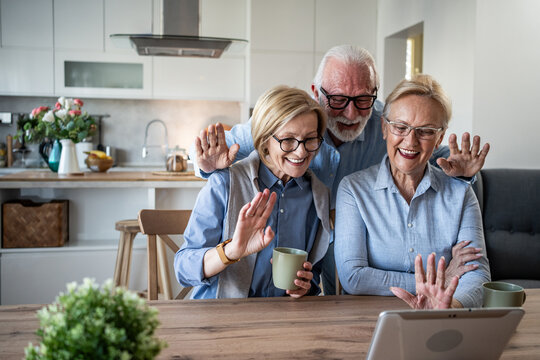 Seniors video calling friends, keeping connected using technology