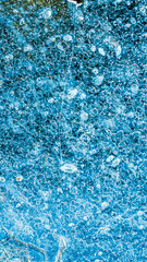 blue ice with visible details. interesting background