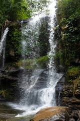 Fototapeta premium Beautiful waterfall landscape in the jungle of a National protected park in Chiang Rai, Thailand