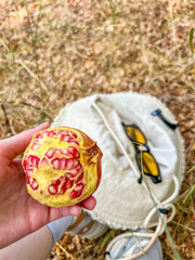 Hand holding decorated Turkish bread simit with sesame seeds wrapped in white napkin in Antalya, Turkey. High quality photograph