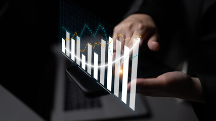 Businessperson conducts financial analysis with a smartphone displaying digital graphs and statistics, showcasing modern data visualization in a contemporary office. Impute