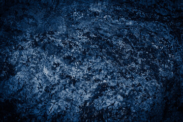 Textured blue rock surface with sharp edges and shadows