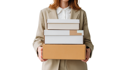 Smiling female student holding a stack of books and folders for her college education