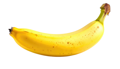 Solitary ripe banana, speckled with brown spots, curves against a solid black background