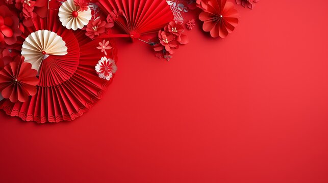 Vibrant red chinese new year decorations featuring paper fans and ornate ornaments against a solid red background - Powered by Adobe
