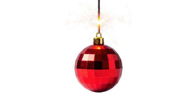 Red Christmas ornament sparkles atop a fuse, isolated against a stark black backdrop